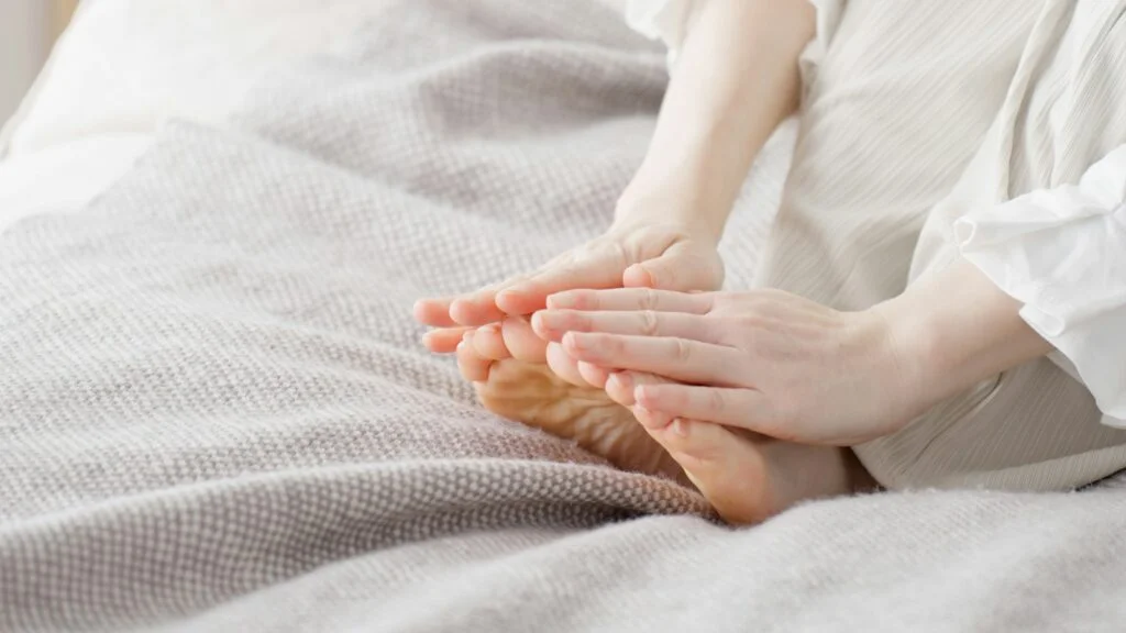 Person rubbing their feet